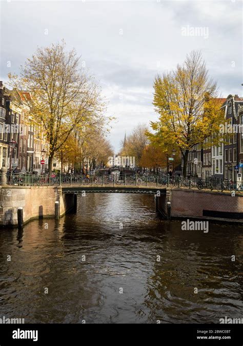 Amsterdam canal with bridge Stock Photo - Alamy