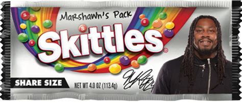 Watch: Marshawn Lynch finally gets his face on a Skittles bag, buries ...