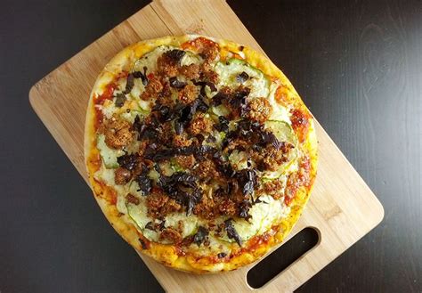 Pizza with fontina cheese, patty pan squash, vegetarian sausage, and ...