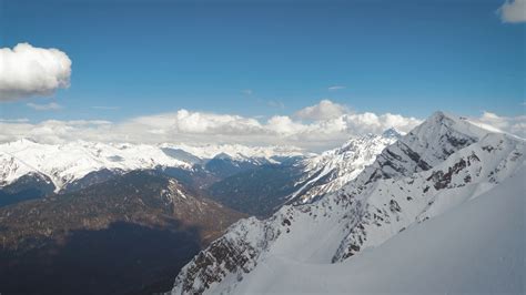 Aerial view snow covered mountains. Travel concept and winter vacation ...