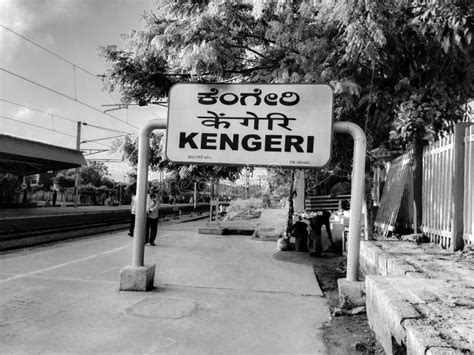 In a Yellow and Black Color Name Board of Kengeri Railway Station with Kannada, English and ...