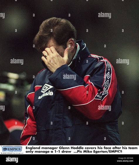 England manager Glenn Hoddle covers his face after his team only manage ...