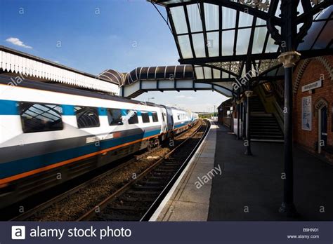 Moving Train passing a platform at Wellingborough train station ...