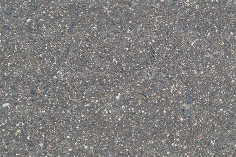 The texture of the background of stone black gray asphalt road with ...