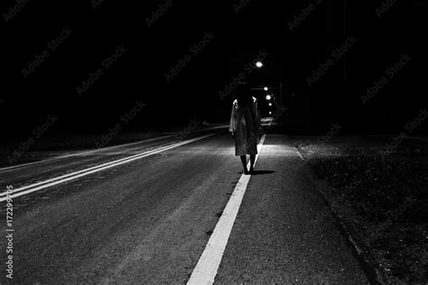 Mysterious Woman, Horror scene of scary ghost woman standing outdoor on street with light in ...