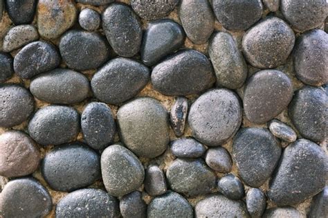 Premium Photo | Rock wall of natural rounded river stones