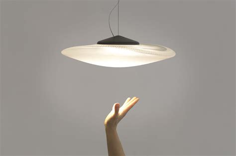 constance guisset forms playful glass loop lamp for fabbian