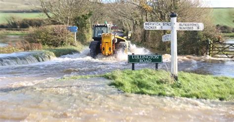 Fast-flowing East Sussex flooding pours towards Alfriston village after ...