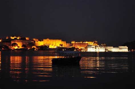 City and Lake palace at Udaipur during night Photograph by Jagdish Karial