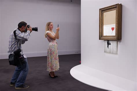 Three years on, shredded Banksy artwork returns to auction | Reuters