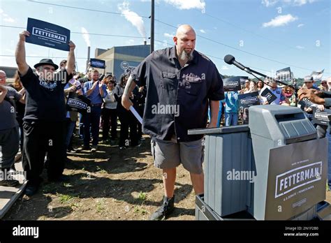 John Fetterman, center, the mayor of Braddock, Pa., comes forward to ...