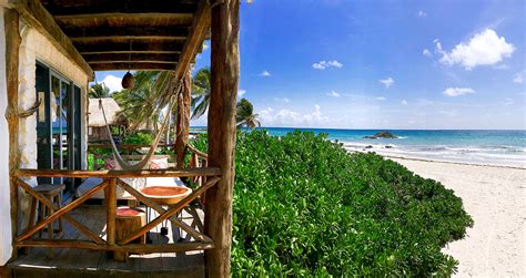 an open door leading to the beach and ocean