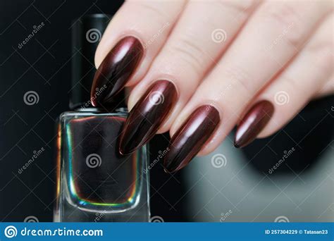 Female Hands with Long Nails and Black and Red Nail Polish Stock Image ...