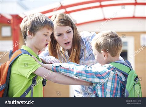 Teacher Stopping Two Boys Fighting Playground Stock Photo 343101878 | Shutterstock