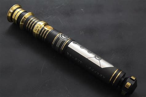 Black and gold Revanite inspired lightsaber with Revan's hilt : swtor