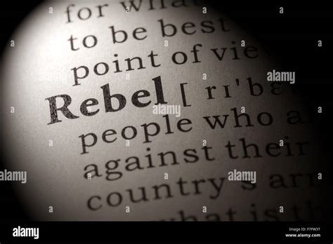 Fake Dictionary, Dictionary definition of the word rebel Stock Photo - Alamy