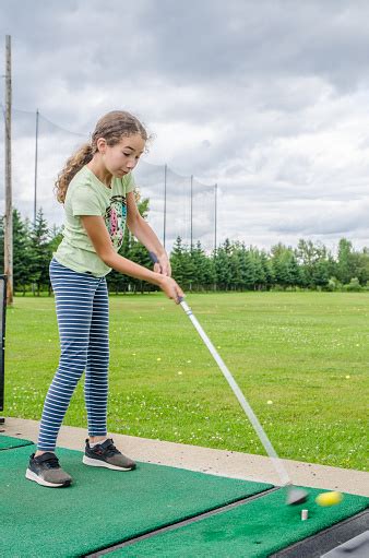 Teenage Girl Practicing Her Golf Swing Stock Photo - Download Image Now ...