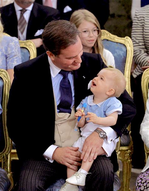 Christopher O'Neill shares a sweet moment with his son, Prince Nicolas, at the christening of ...