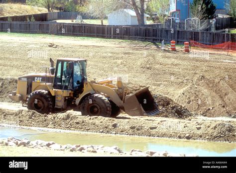 Wheel loader at construction site Stock Photo - Alamy