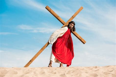 Jesus Walking with Wooden Cross in Desert Stock Photo - Image of wood, handsome: 196966708