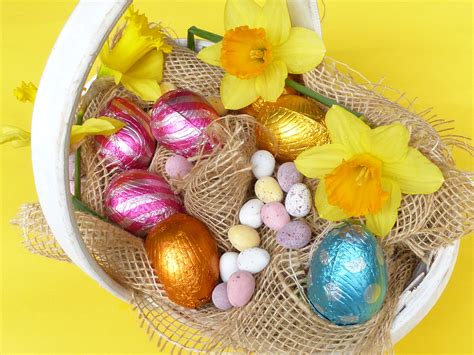 Easter egg hunt basket filled with assorted eggs Creative Commons Stock Image