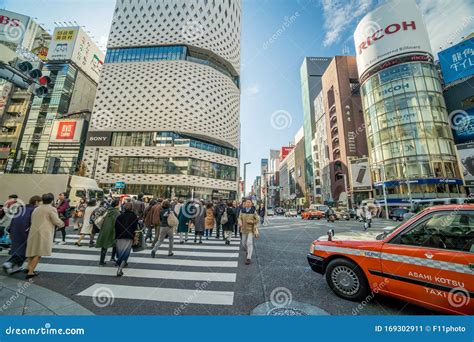 Ginza Shopping District and Pedestrian Crossing the Street at Ginza ...