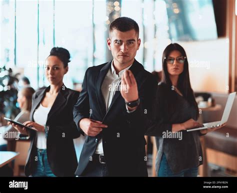 Group of successful business people standing together at office Stock Photo - Alamy