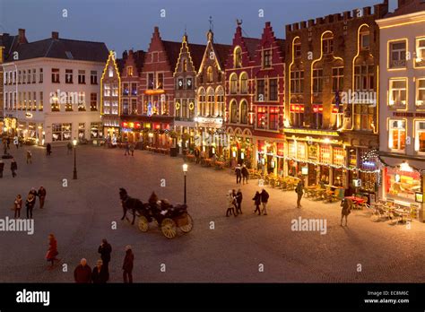 Bruges Belgium city centre at dusk, Christmas in the Market ( Markt ) Square, Bruges Belgium ...