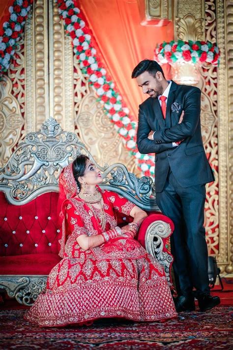 Candid Couple Shot - Bride in a Red Sequinned Lehenga and Groom in a T… | Indian wedding ...