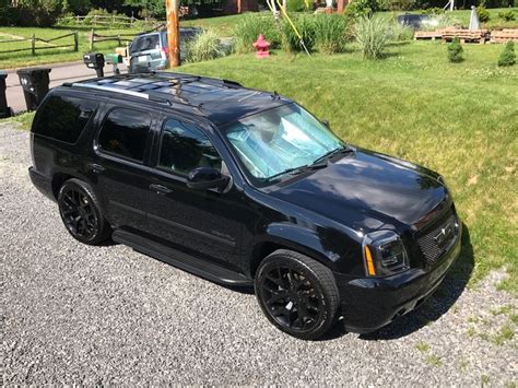 Black SUV parked on the side of the road