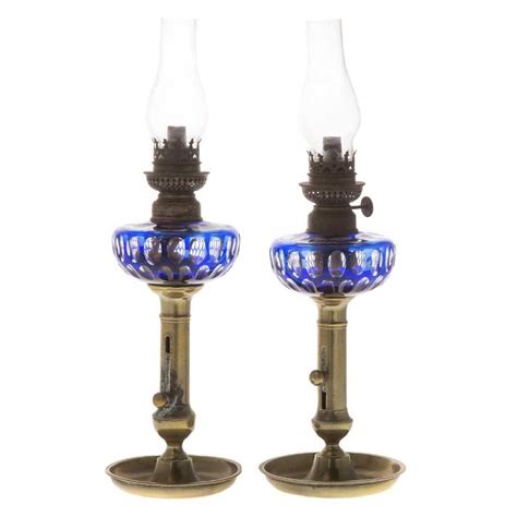 Pair Bohemian cased glass peg oil lamps