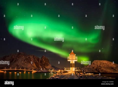 Aurora borealis above lighthouse and snowy islands of Lofoten Stock Photo - Alamy