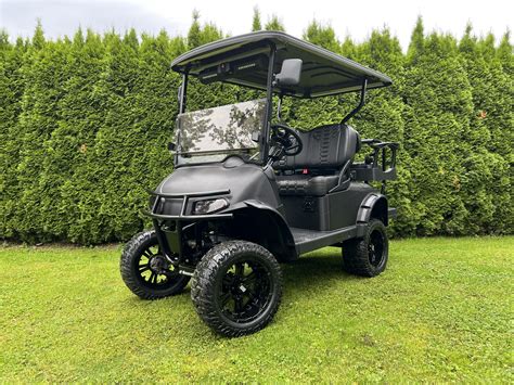 Super Custom EZGO RXV Carbon Fiber Wrapped Cart with Stereo and Sub - Big Thunder Golf Carts