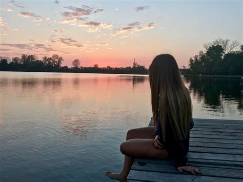 Girl looking at lake sunset | Lake pictures, Sunset girl, Lake sunset