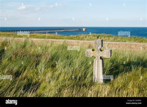 Celtic cross in Spion Kop cemetery on The Headland in Hartlepool on the north east coast of ...