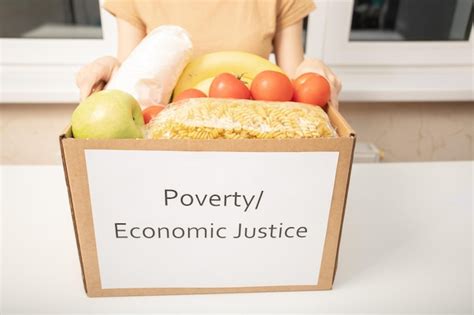 Premium Photo | Donation and charity for the poor women's hands holding a box of food products