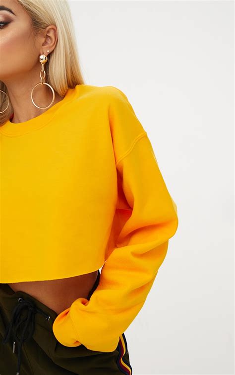 Yellow Ultimate Cropped Sweater | Tops | PrettyLittleThing USA