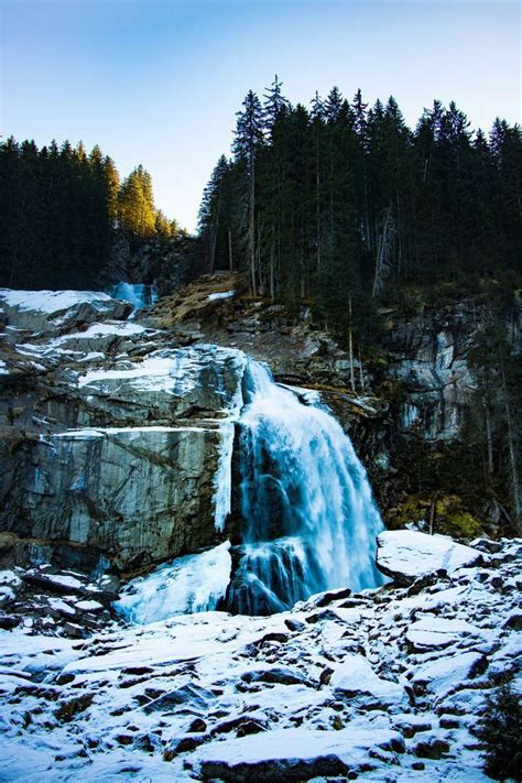 Krimmler Wasserfall, Austria, one of the highest waterfalls in Europe. Icy waterfall in winter ...