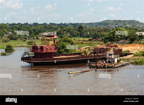 South America, Venezuela, Orinoco River. Tug and boat loading supplies on river Stock Photo - Alamy