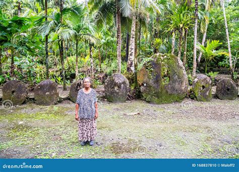 Ing in the Jungle by a Bank of Yapese Stone Money Rai. Federated States of Micronesia, Oceania ...