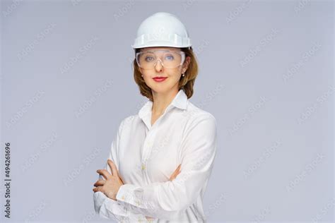 engineer woman white helmet and safety goggles Stock Photo | Adobe Stock