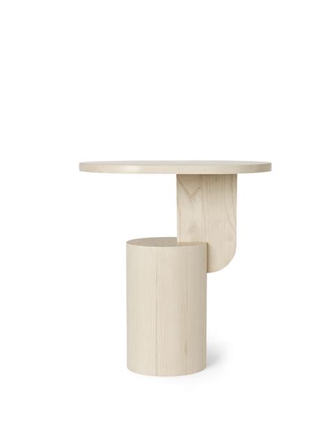 Crafted from ash, this design forms a sturdy, yet sculptural table. It's a subtle piece of art ...
