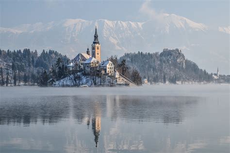 Photo Gallery: Lake Bled draped in winter white in the winter