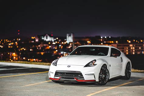 Modern coupe car parked in dark city at night · Free Stock Photo