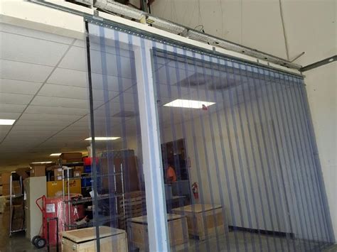 Slide Open PVC Strip Curtain Doors with Sliding Roller Track. Plastic Strip Doors Slide open and ...