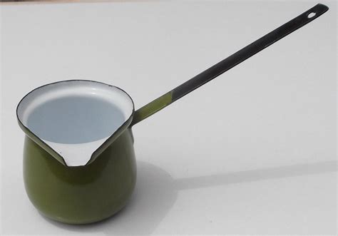 small green enamel butter melter pouring sauce pot