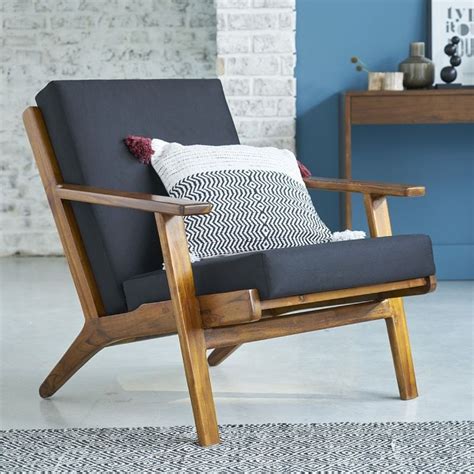 Ce fauteuil en teck ose le vintage avec une touche de scandinave. Il ...