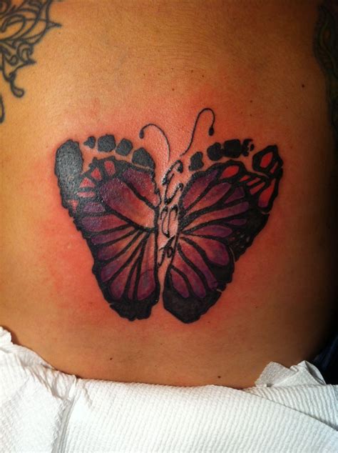 Butterfly footprint tattoo if I have a girl I am so getting this!!! With her initials in the ...