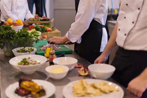 team cooks and chefs preparing meal 12709644 Stock Photo at Vecteezy