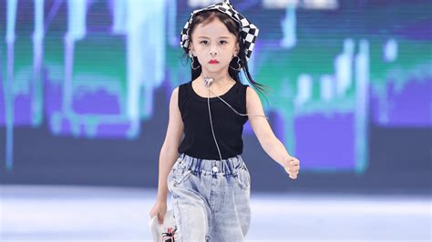 The cute and charming little girls walked confidently in the fashion ...